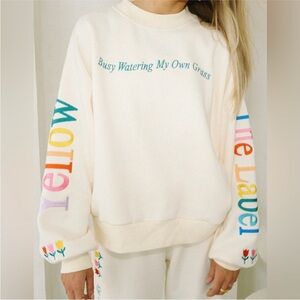 Cream Crewneck Sweatshirt w/ Rainbow Lettering & Embroidered Floral Accents
